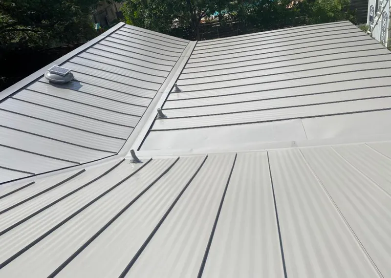 Solar attic fan installed on a metal roof for Roof Ventilation in East Lake